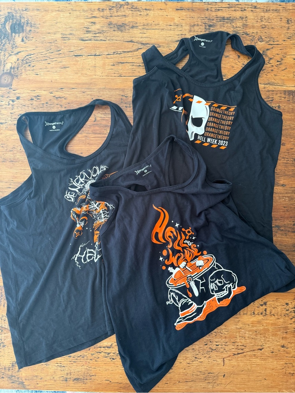 NWT- never worn Orangetheory HELL WEEK tanks from 2023, 2024 and 2025